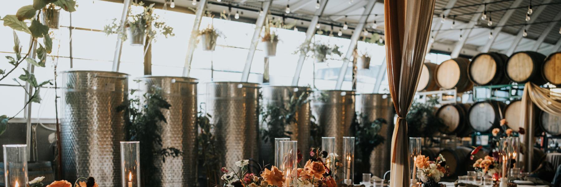 serpentine table with warm earth tone floral centerpieces