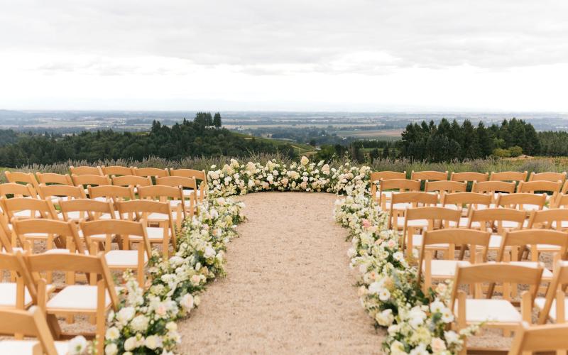 floral aisle decor and ceremony backdrop at Black Walnut Inn