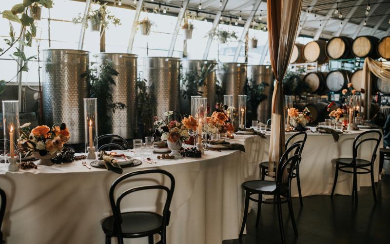 serpentine table with warm earth tone floral centerpieces