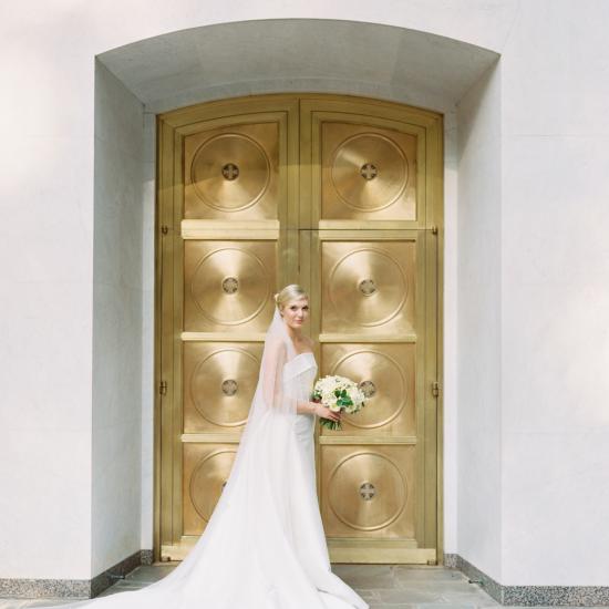 bride in front of The Grotto door