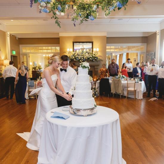 cake cutting with chandelier installation overhead