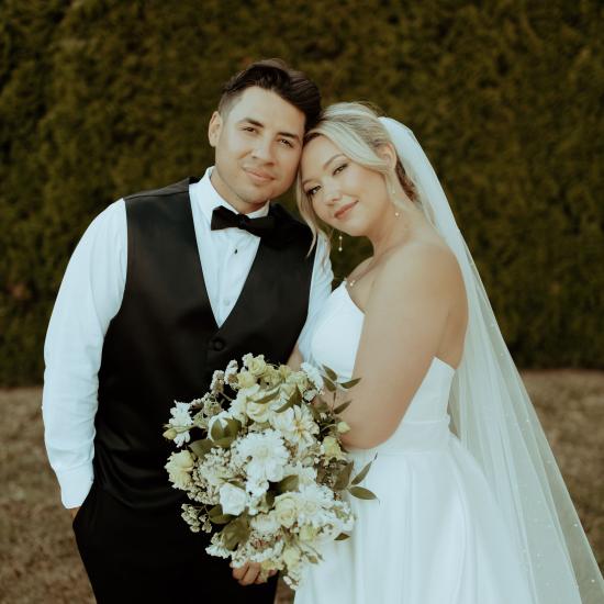 bride and groom smiling