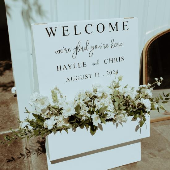 welcome sign planter box with flowers