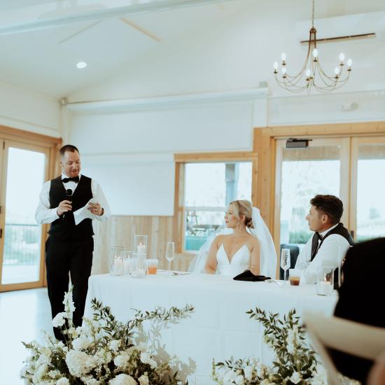 wedding guest giving a toast