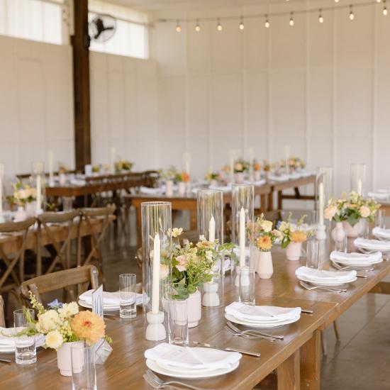 reception tables with flowers and candles