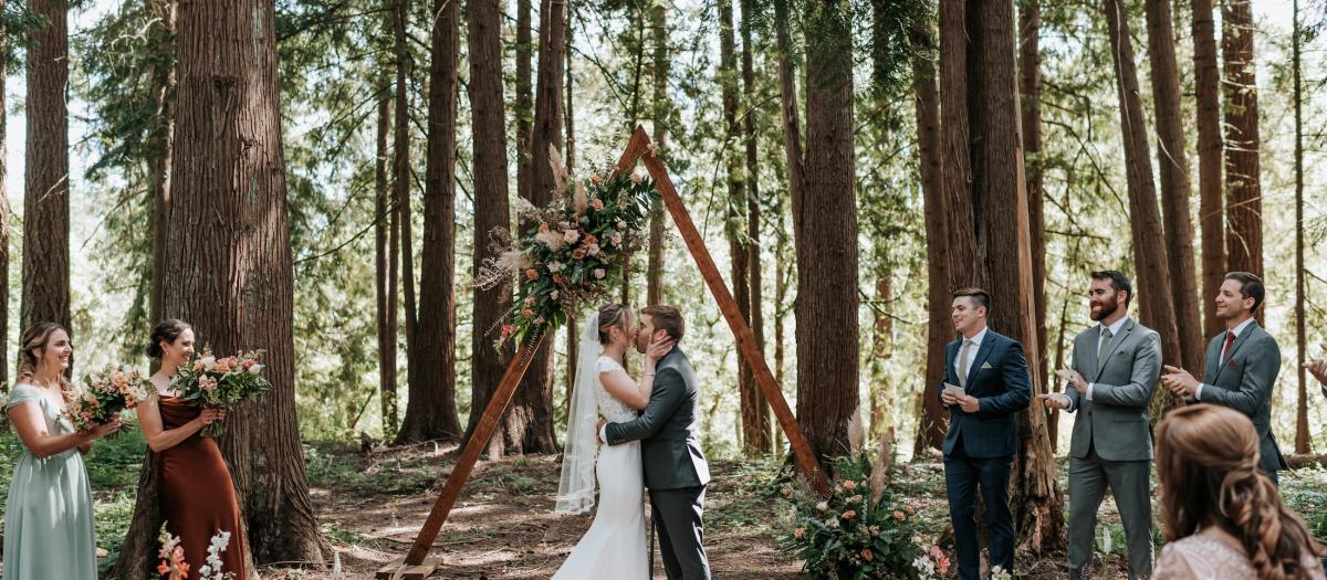 R&C in front of ceremony arbor